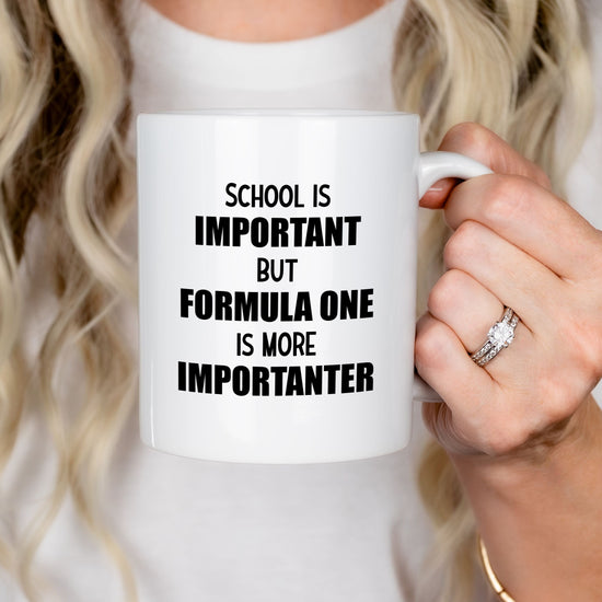 White mug with quote "School is important but Formula 1 is more Importanter"